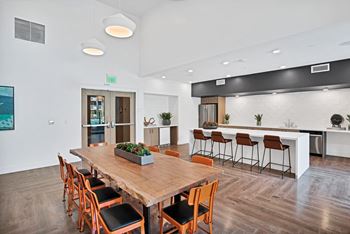 Resident social lounge and dining space with pool table, chef’s kitchen and flat screen tv’s